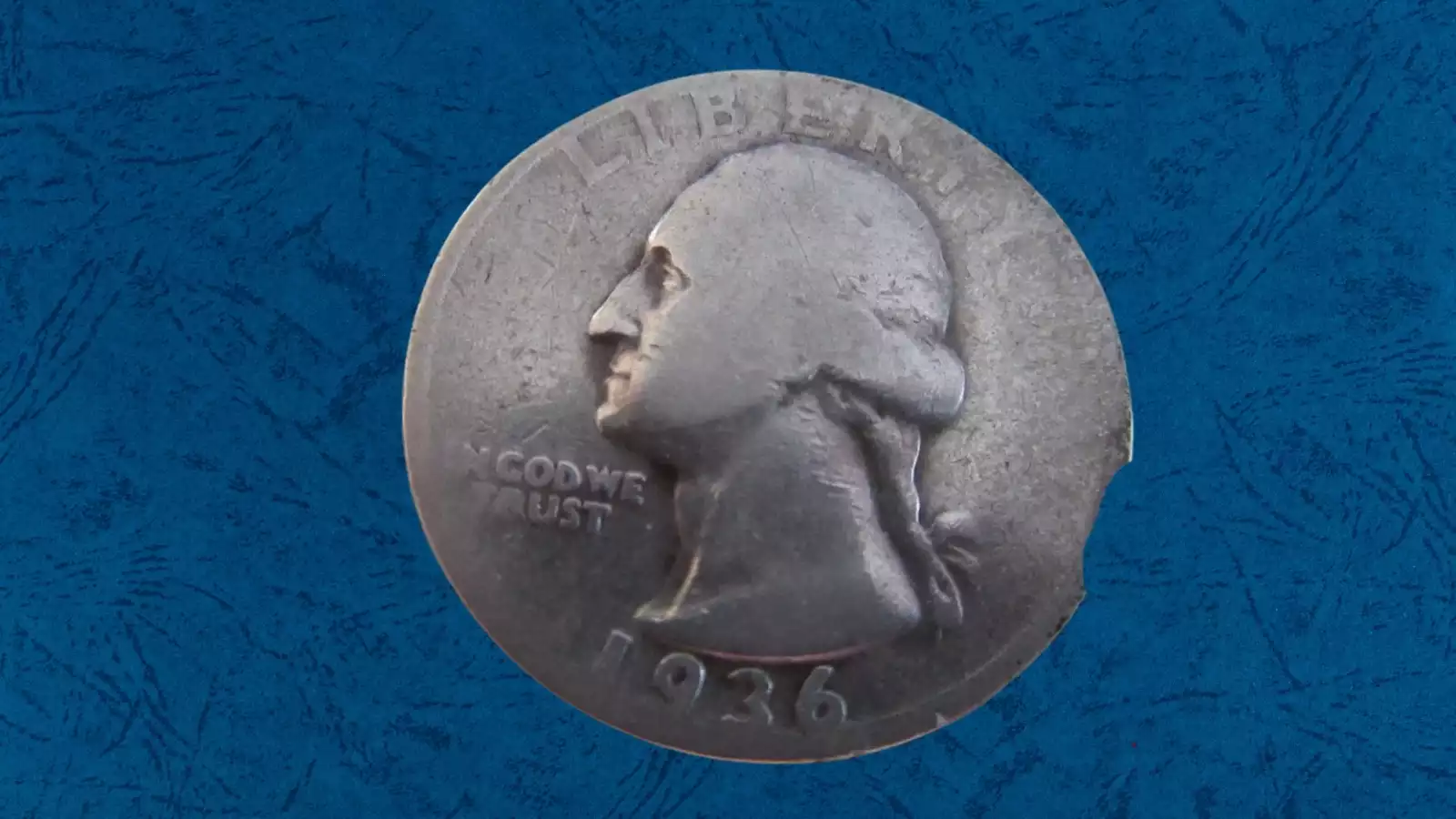 1936 quarter clipped planchet error showing curved section of silver missing from the coin's edge at approximately 15-20% clip